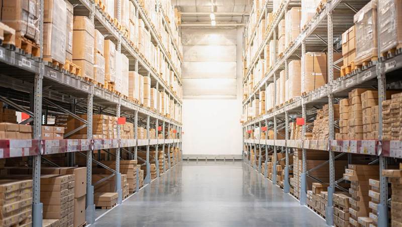 Racked warehouse aisle stocked with consumables